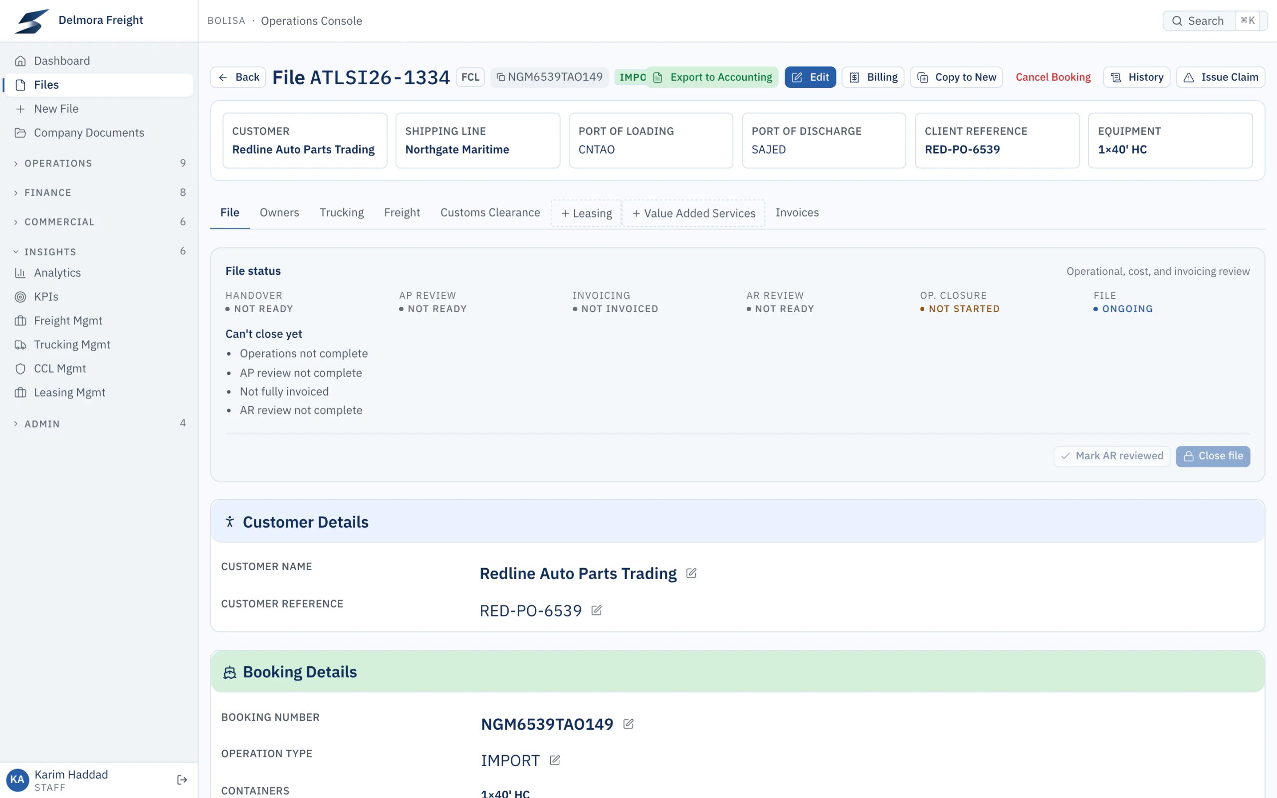 An import shipment file opened from the drilldown. Its status panel shows the file can’t close yet and lists why: operations, cost review, invoicing and customer review are not complete.